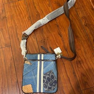 New, unused with tags Coach Jean purse